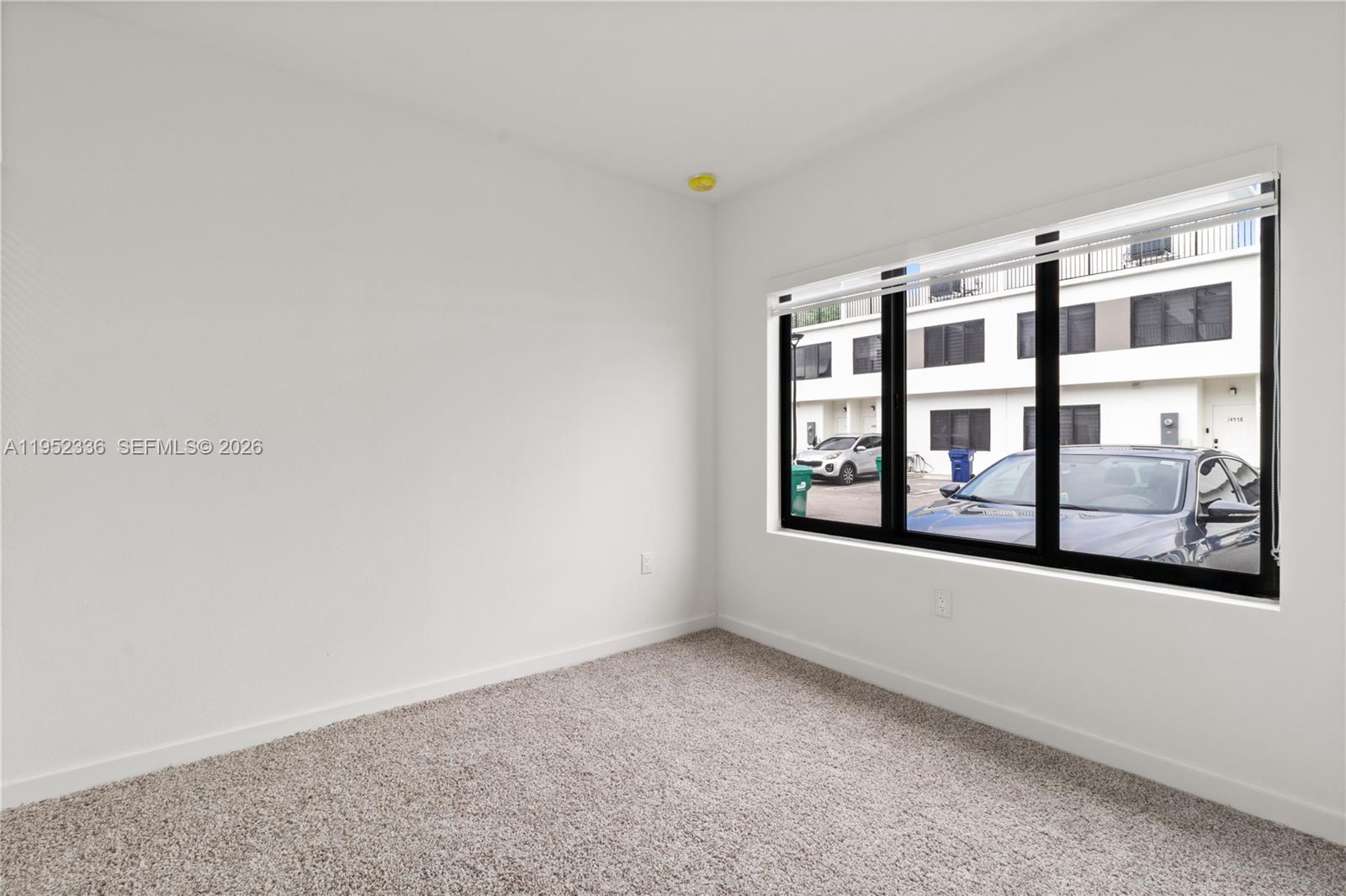 14571 Southwest 261st Street Homestead, FL 33032 - Photo 14 of 30 a view of an empty room with a window