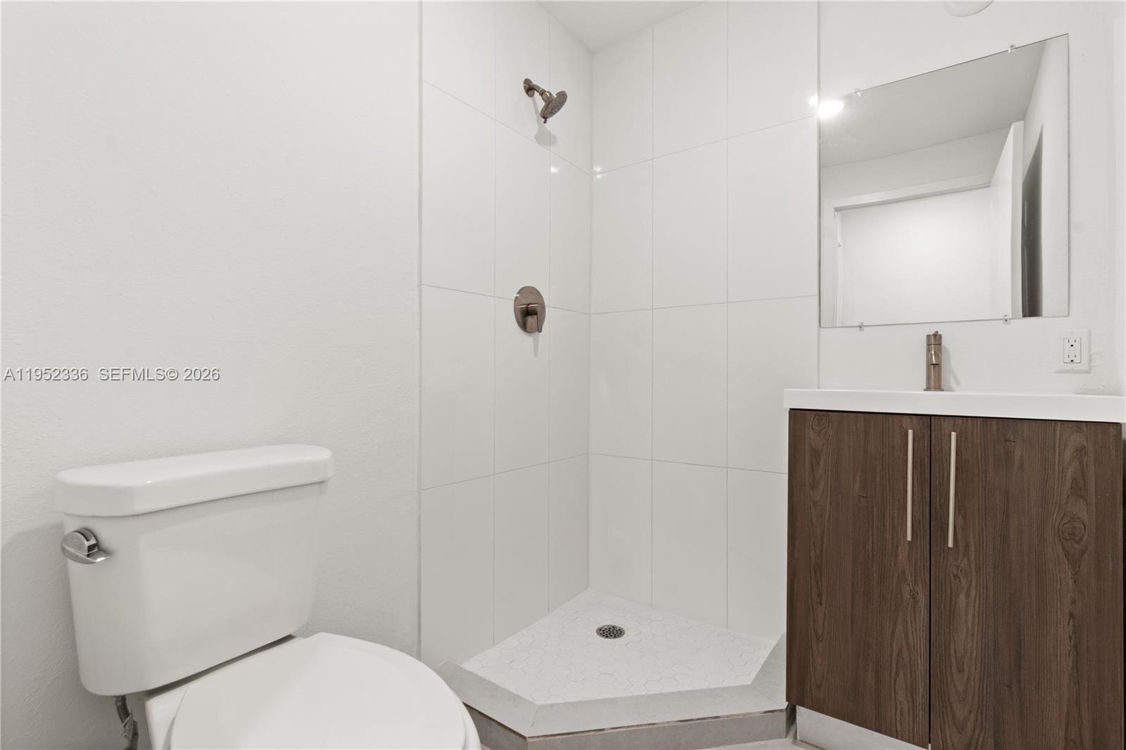 14571 Southwest 261st Street Homestead, FL 33032 - Photo 15 of 30 a bathroom with a toilet a sink and shower