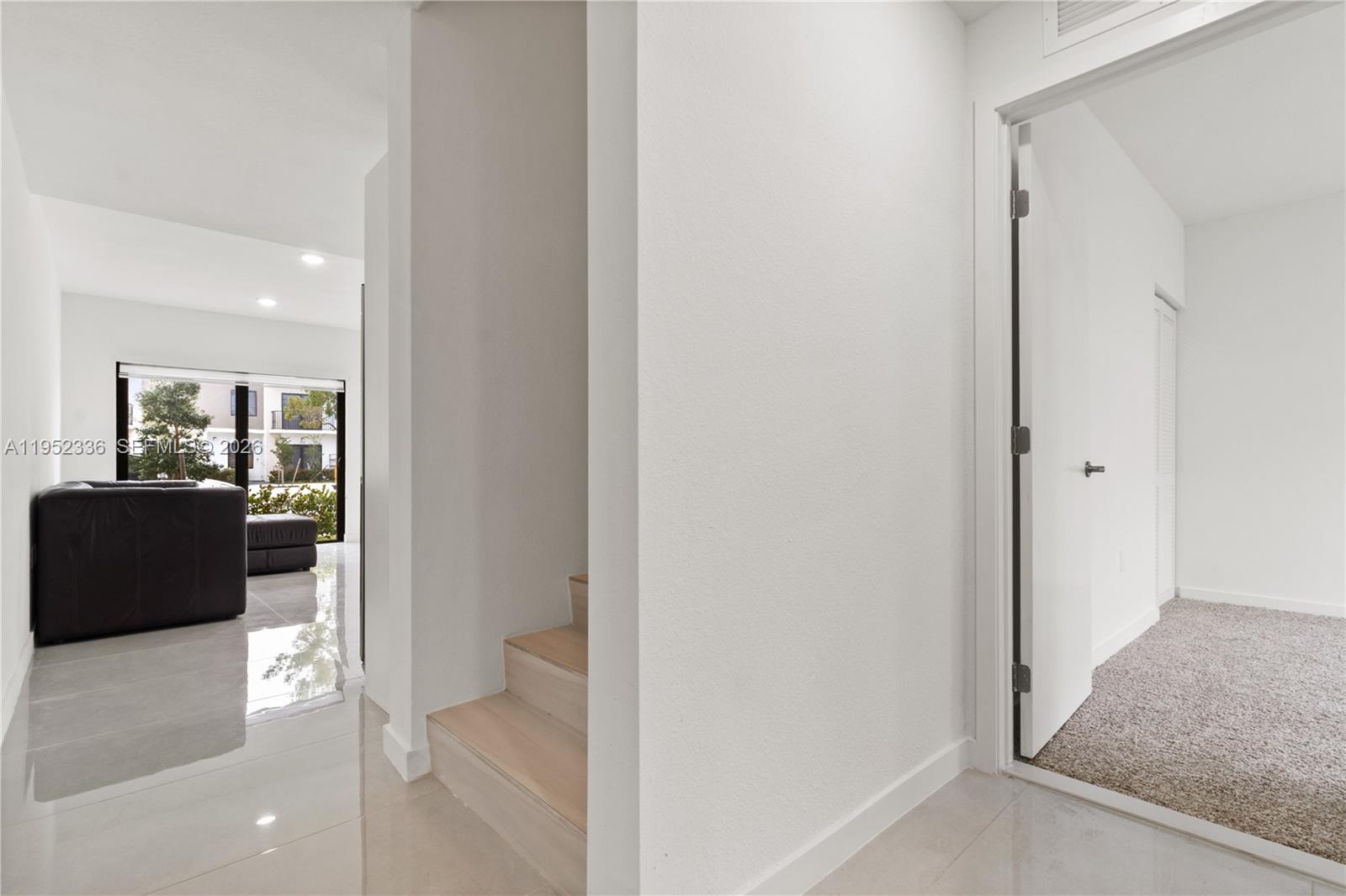 14571 Southwest 261st Street Homestead, FL 33032 - Photo 16 of 30 a view of a hallway with a livingroom and a couch