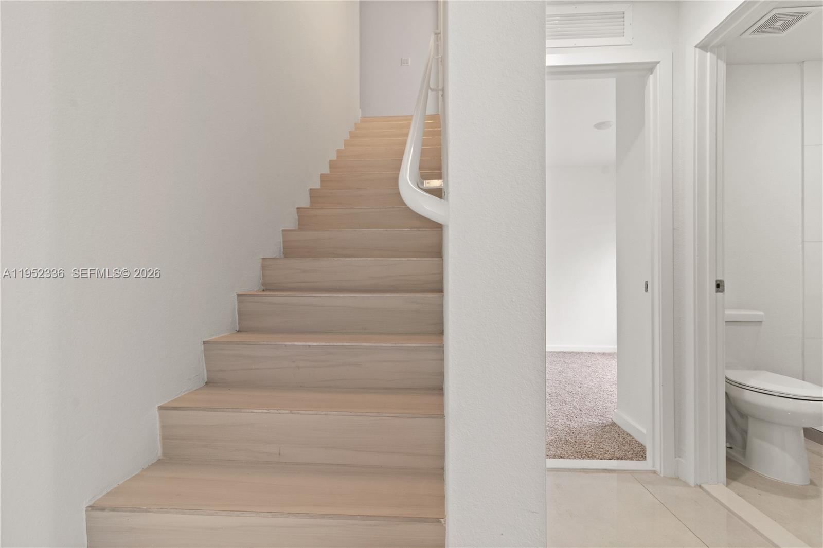 14571 Southwest 261st Street Homestead, FL 33032 - Photo 17 of 30 a view of staircase with white walls