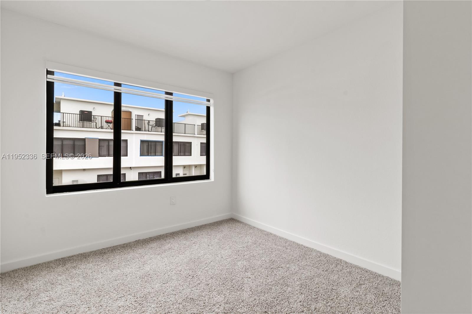 14571 Southwest 261st Street Homestead, FL 33032 - Photo 18 of 30 a view of an empty room with a window