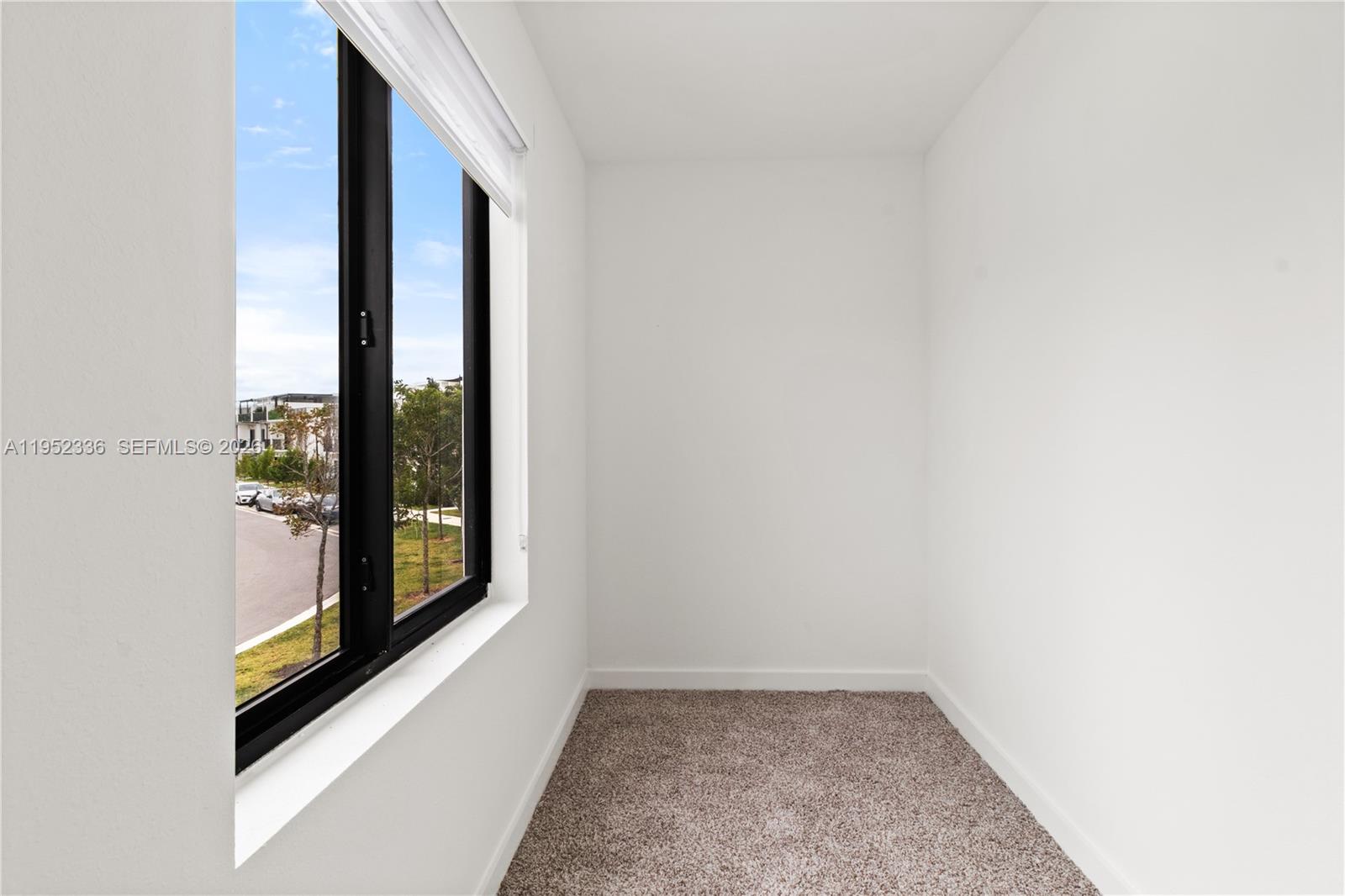 14571 Southwest 261st Street Homestead, FL 33032 - Photo 19 of 30 a view of an empty room and window