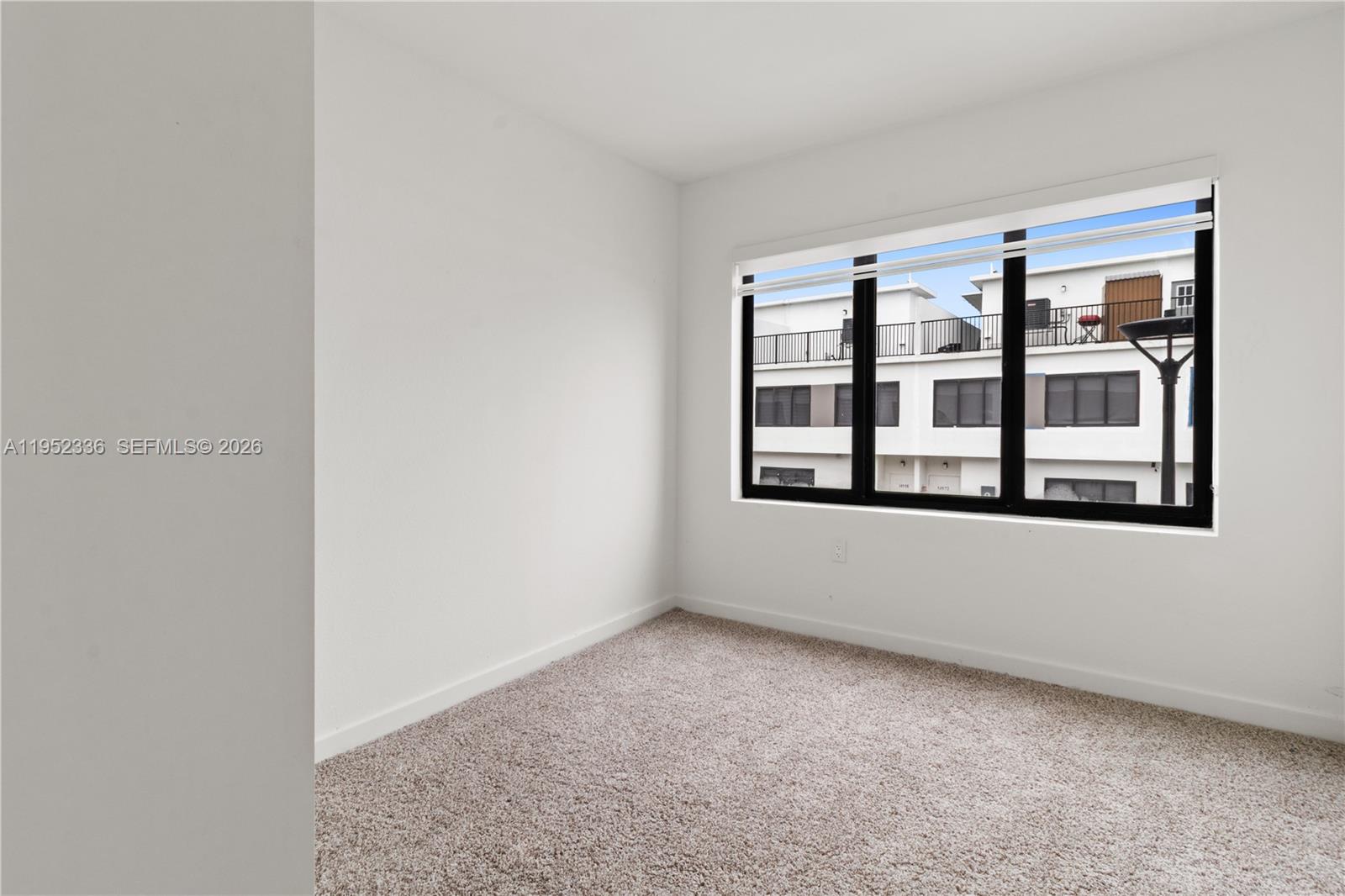 14571 Southwest 261st Street Homestead, FL 33032 - Photo 20 of 30 a view of an empty room with a window