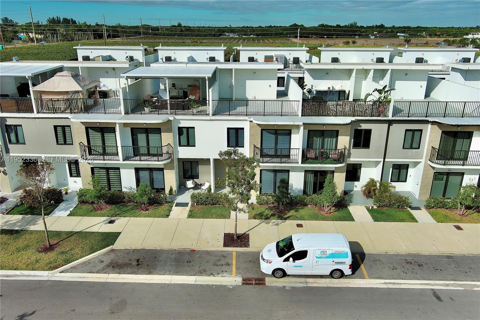 14571 Southwest 261st Street Homestead, FL 33032 - Photo 27 of 30 a front view of a building with street view