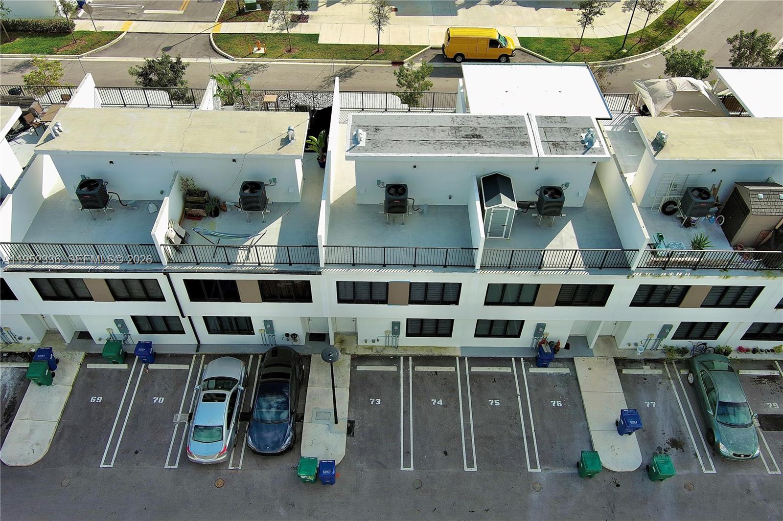 14571 Southwest 261st Street Homestead, FL 33032 - Photo 28 of 30 a utility room with lots of different colored cloths