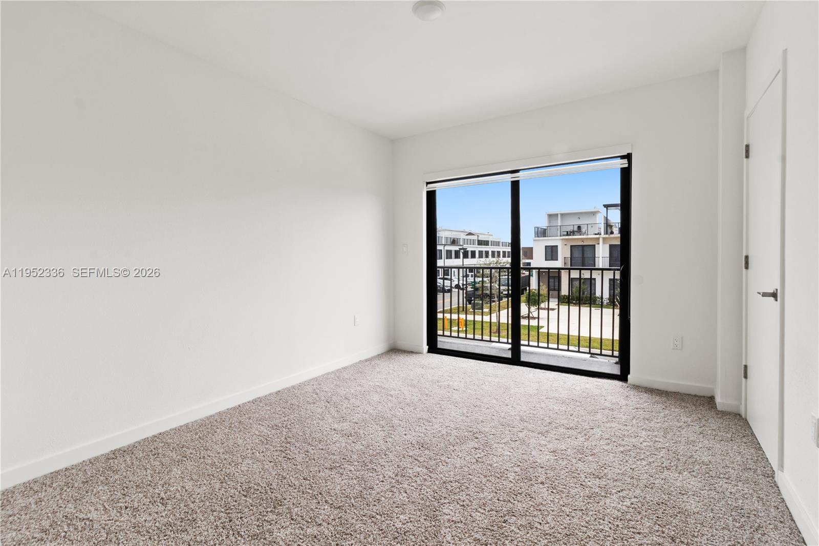 14571 Southwest 261st Street Homestead, FL 33032 - Photo 5 of 30 a view of an empty room with a window