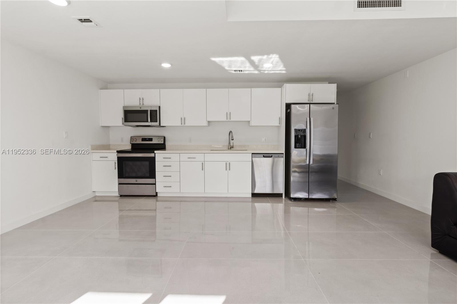 14571 Southwest 261st Street Homestead, FL 33032 - Photo 9 of 30 a view of kitchen with microwave and cabinets