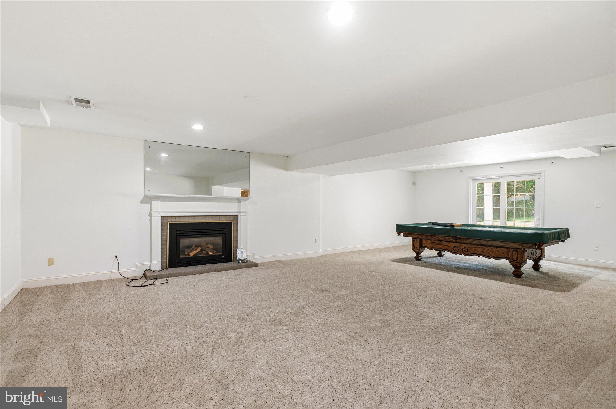 10019 Kendale Road Potomac, MD 20854 - Photo 49 of 64 Recreation Room with FP #3, Level W/O to rear yard