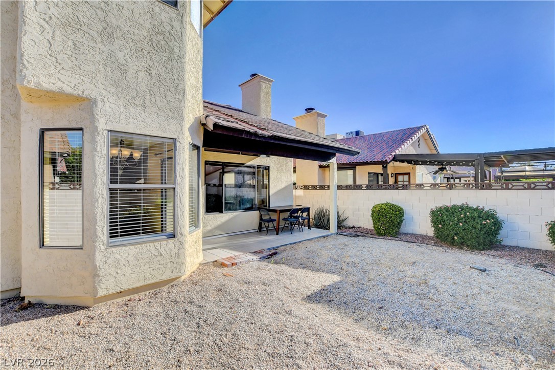 6440 Hartwood Road Las Vegas, NV 89108 - Photo 55 of 59 A well-maintained gravel yard offers a low-maintenance exterior alongside a covered patio.