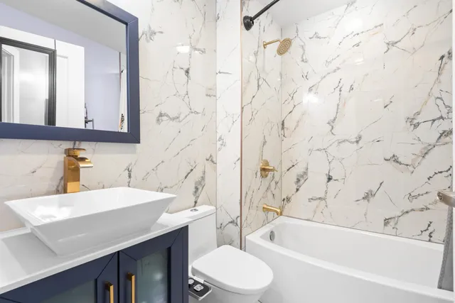 a kitchen with stainless steel appliances a refrigerator sink and cabinets