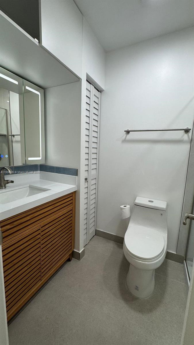 927 Northwest 106th Ave Circle Miami, FL 33172 - Photo 15 of 24 a bathroom with a sink and a toilet