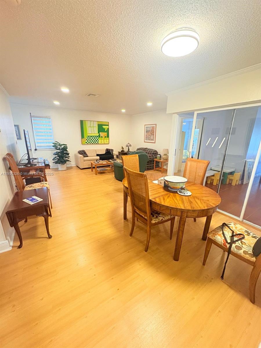 927 Northwest 106th Ave Circle Miami, FL 33172 - Photo 9 of 24 a view of a dining room with furniture