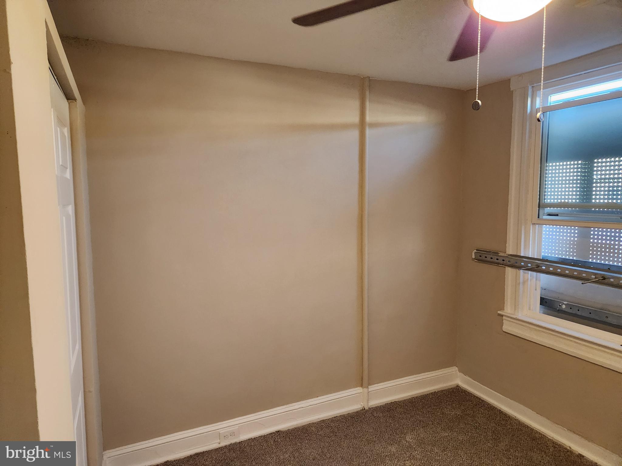 516 North Robinson Street Baltimore, MD 21205 - Photo 11 of 21 a room with a wooden floor and a window