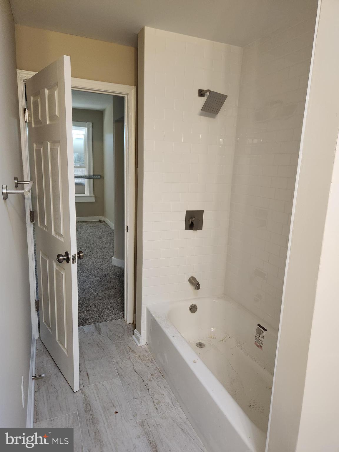 516 North Robinson Street Baltimore, MD 21205 - Photo 15 of 21 a bathroom with a bathtub and a shower