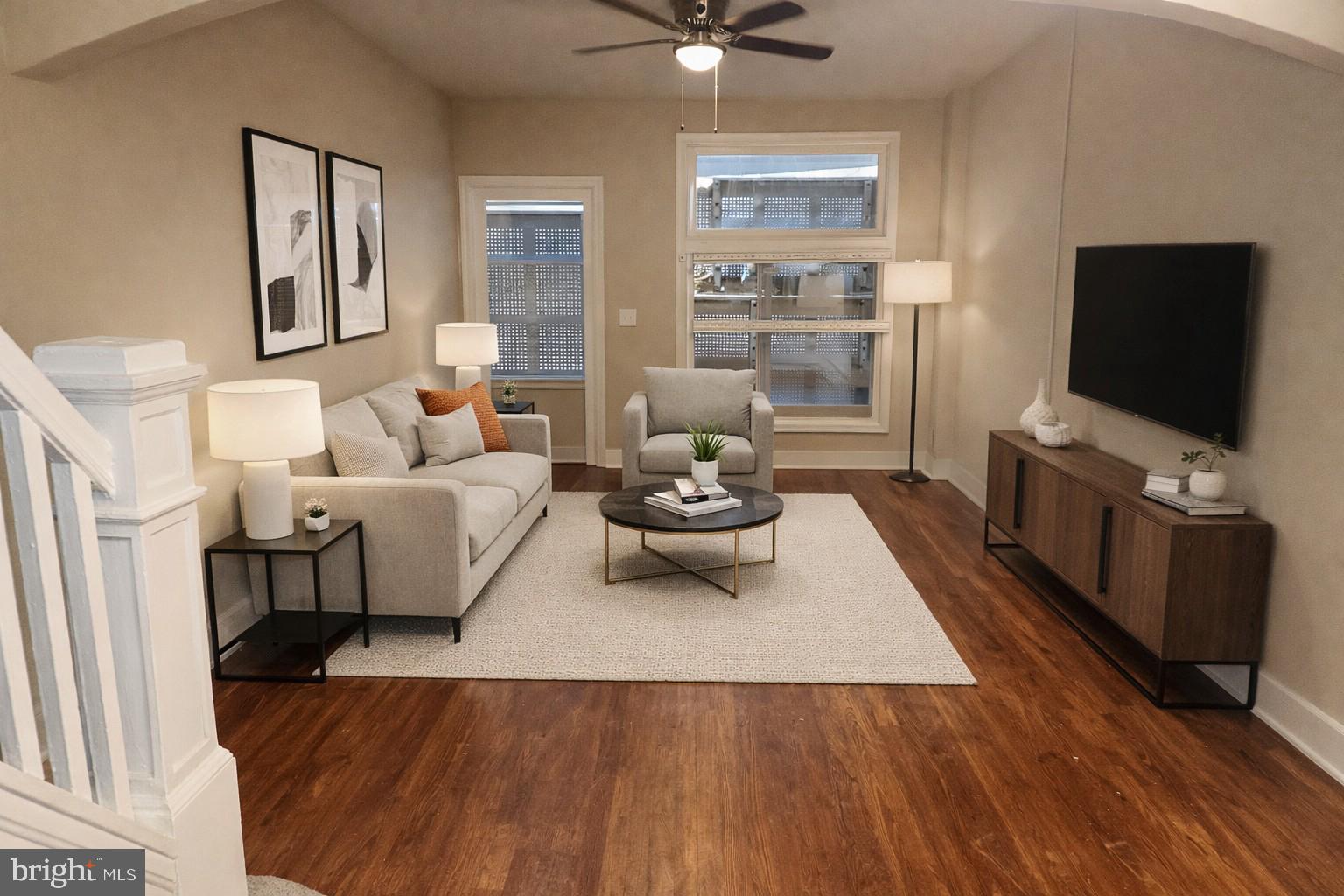 516 North Robinson Street Baltimore, MD 21205 - Photo 2 of 21 a living room with furniture and a flat screen tv