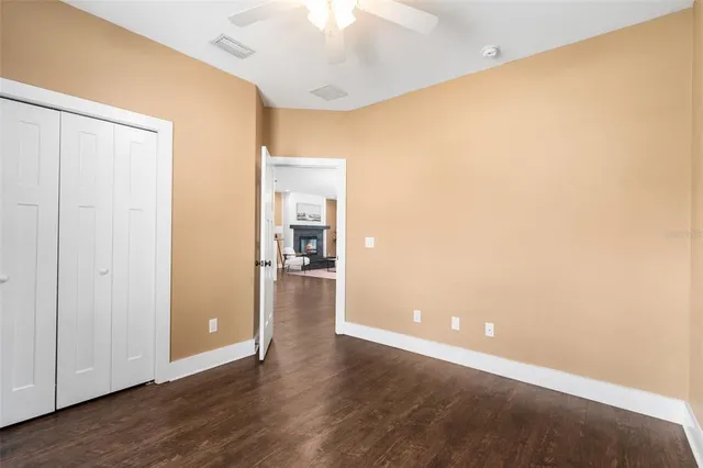 a view of a room with wooden floor