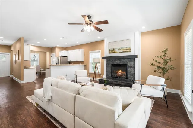 a living room with furniture and a fireplace