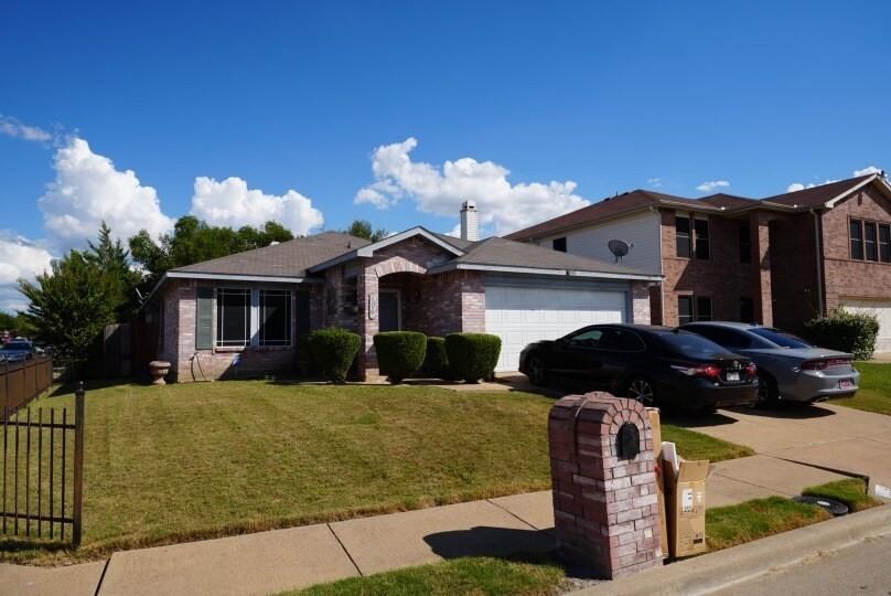 4835 Berridge Lane Dallas, TX 75227 - Photo 4 of 10 a front view of a house with a yard