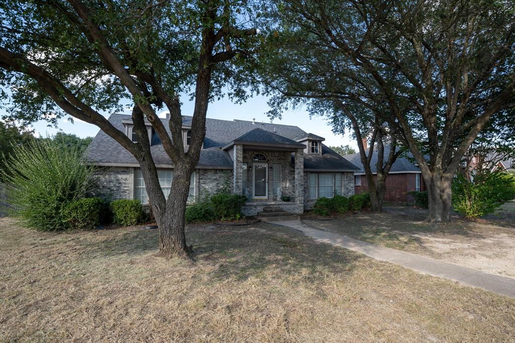 4835 Berridge Lane Dallas, TX 75227 - Photo 6 of 10 a view of a house with a yard and tree