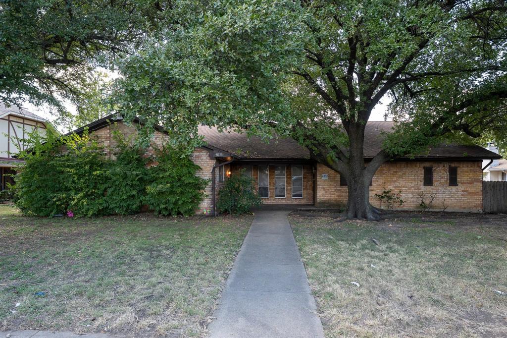 4835 Berridge Lane Dallas, TX 75227 - Photo 10 of 10 a view of a house with a large tree and a big yard