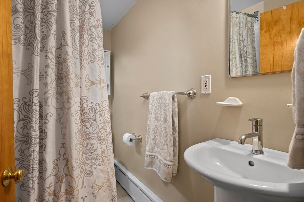 20 Butler Street Medford, MA 02155 - Photo 17 of 29 a bathroom with a sink and a mirror