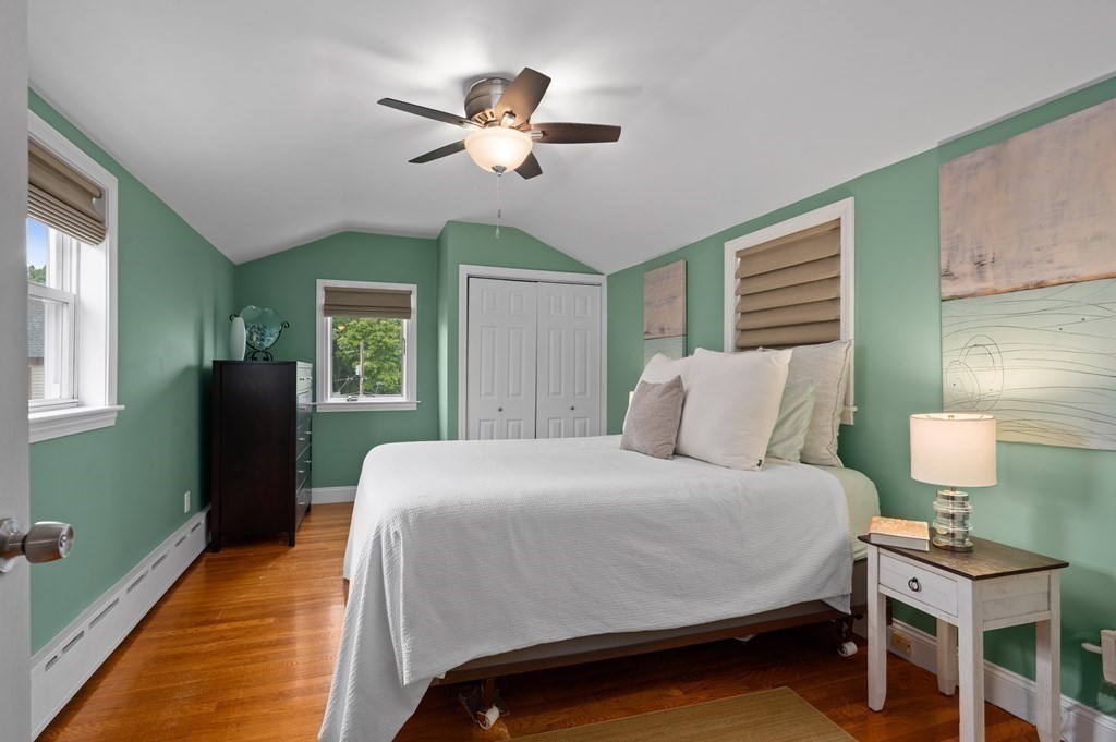 20 Butler Street Medford, MA 02155 - Photo 18 of 29 a bedroom with a bed and a chandelier