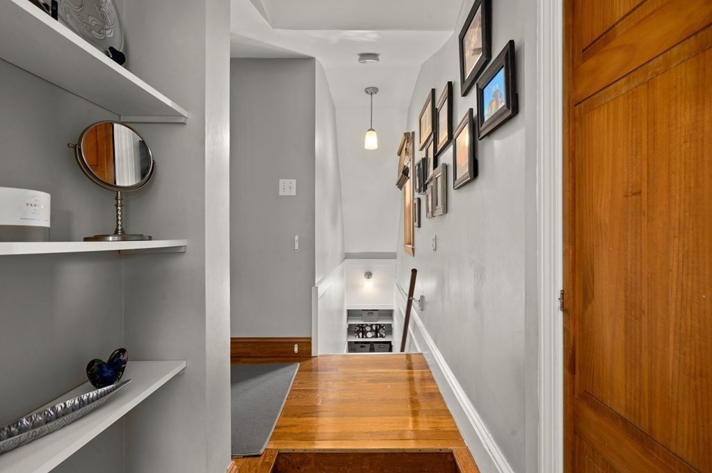 20 Butler Street Medford, MA 02155 - Photo 20 of 29 a view of a hallway with wooden floor and staircase