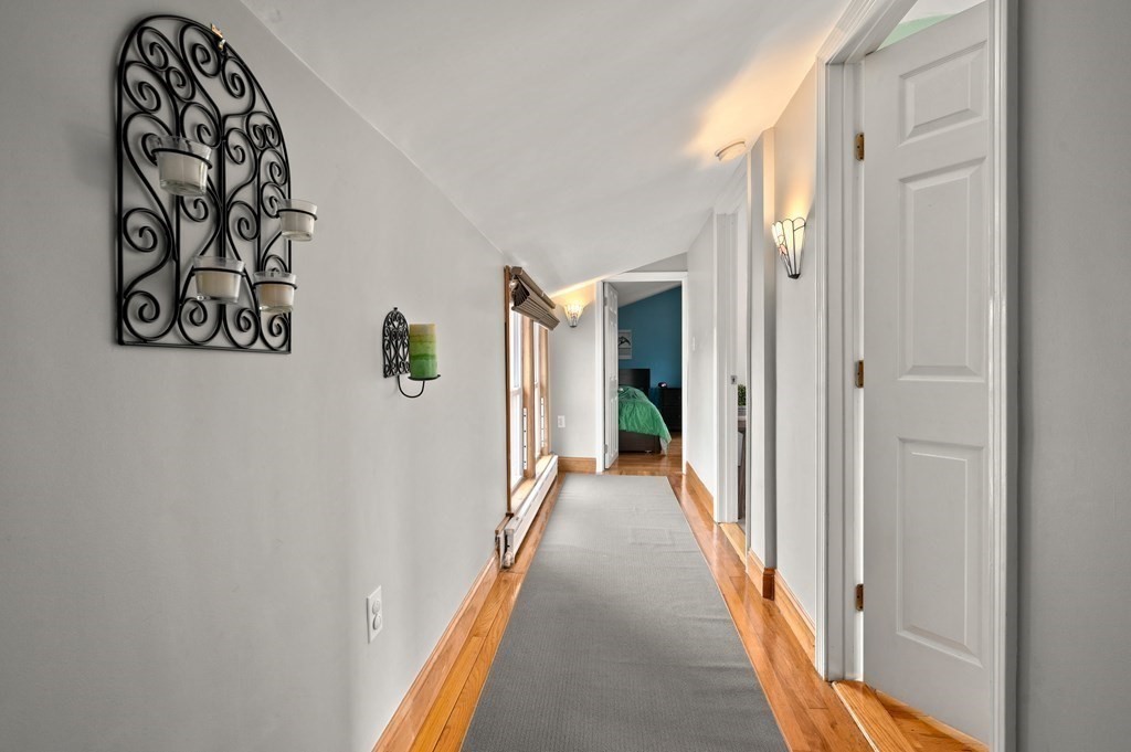 20 Butler Street Medford, MA 02155 - Photo 21 of 29 a view of a hallway with wooden floor and closet