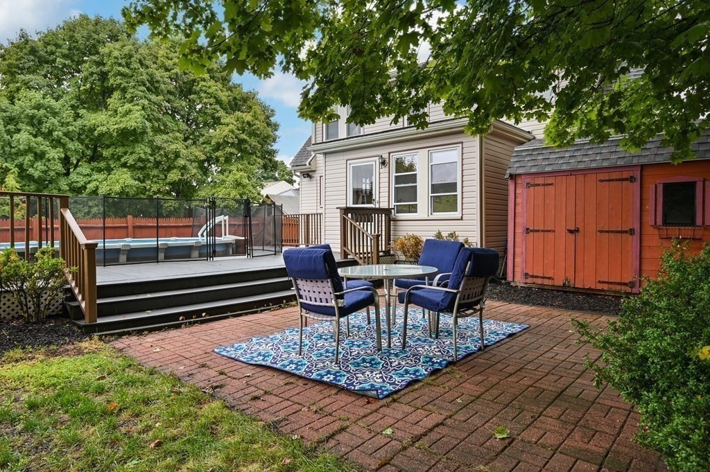 20 Butler Street Medford, MA 02155 - Photo 29 of 29 a view of a house with backyard and sitting area