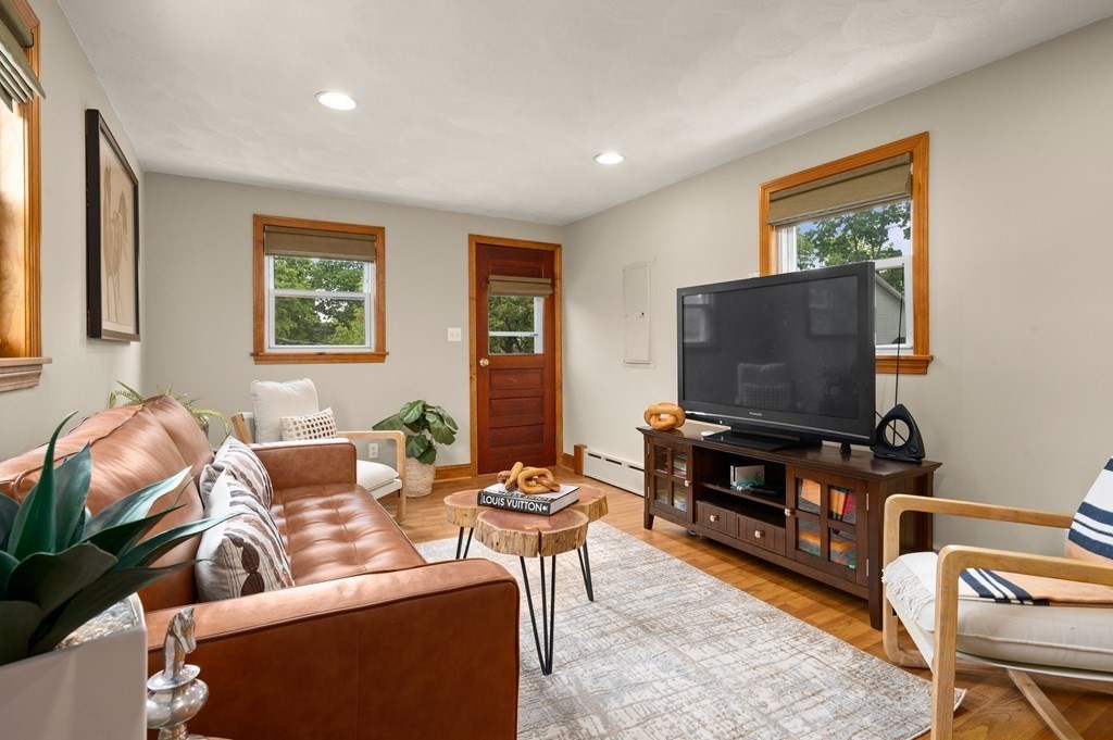 20 Butler Street Medford, MA 02155 - Photo 9 of 29 a living room with furniture and a flat screen tv