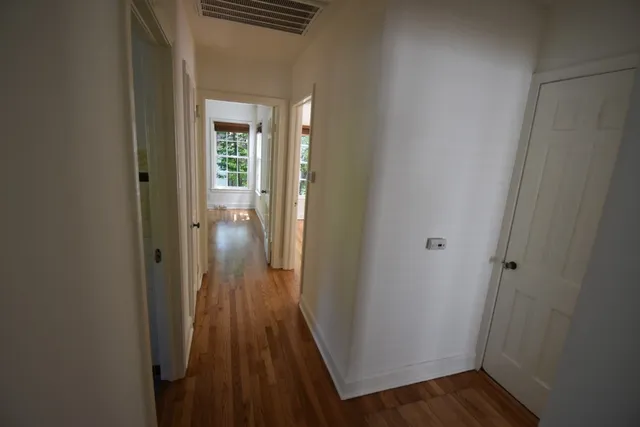 a bathroom with a sink mirror and toilet