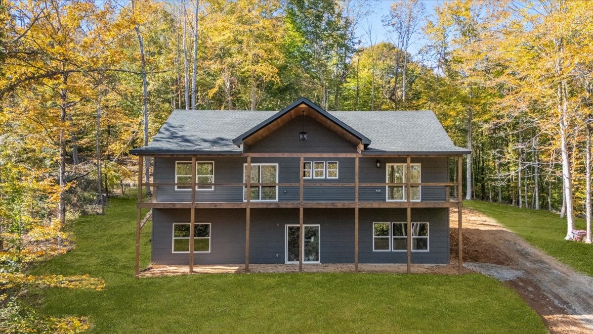 854 Little Leatherwood Road Vanleer, TN 37181 - Photo 1 of 36 a front view of a house with a garden