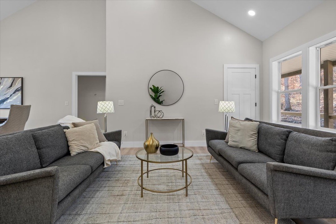 854 Little Leatherwood Road Vanleer, TN 37181 - Photo 12 of 36 a living room with furniture a couch and a large window