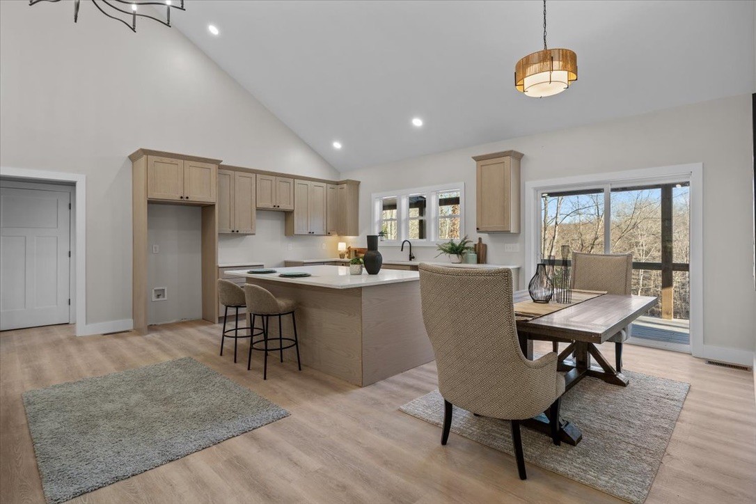 854 Little Leatherwood Road Vanleer, TN 37181 - Photo 13 of 36 a view of a dining room with furniture window and wooden floor