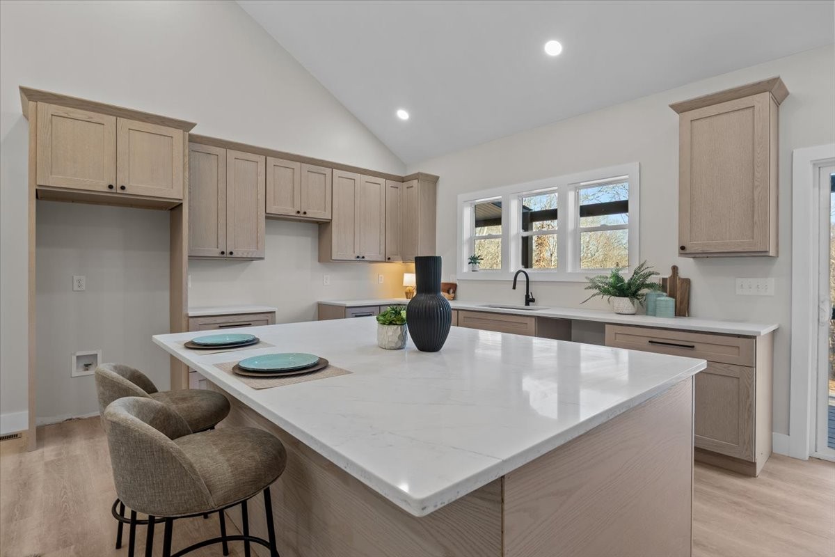 854 Little Leatherwood Road Vanleer, TN 37181 - Photo 16 of 36 a kitchen with stainless steel appliances granite countertop a stove a sink a refrigerator and white cabinets