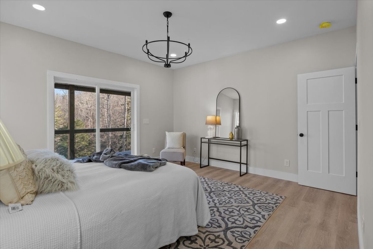 854 Little Leatherwood Road Vanleer, TN 37181 - Photo 18 of 36 a bedroom with a bed a window and walk in closet