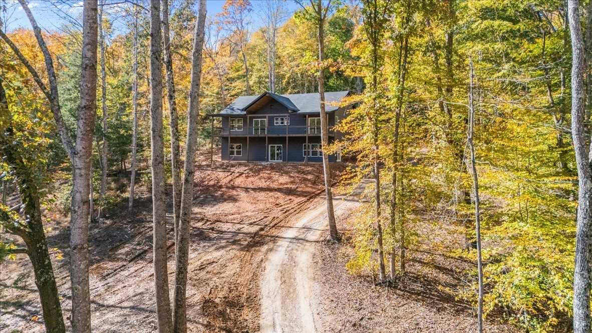 854 Little Leatherwood Road Vanleer, TN 37181 - Photo 2 of 36 a pathway of a house with a yard