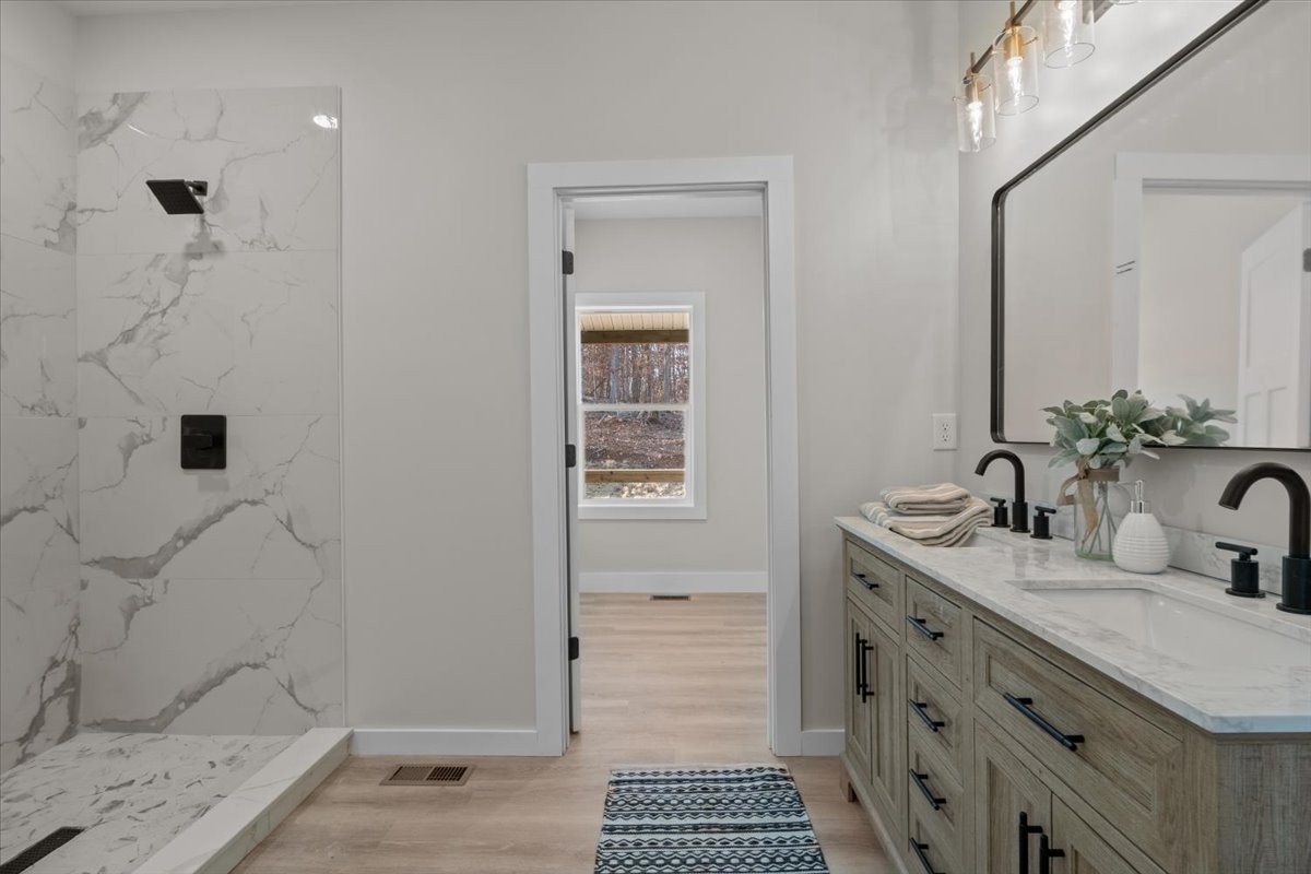 854 Little Leatherwood Road Vanleer, TN 37181 - Photo 22 of 36 a bathroom with a sink a vanity and a mirror