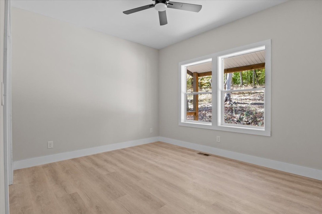 854 Little Leatherwood Road Vanleer, TN 37181 - Photo 24 of 36 a view of an empty room with a window