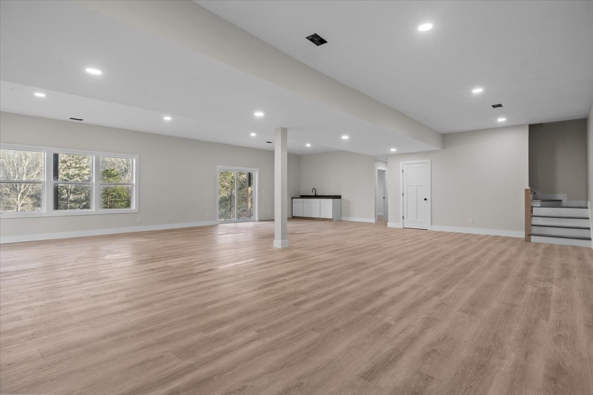 854 Little Leatherwood Road Vanleer, TN 37181 - Photo 28 of 36 an empty room with wooden floor and windows