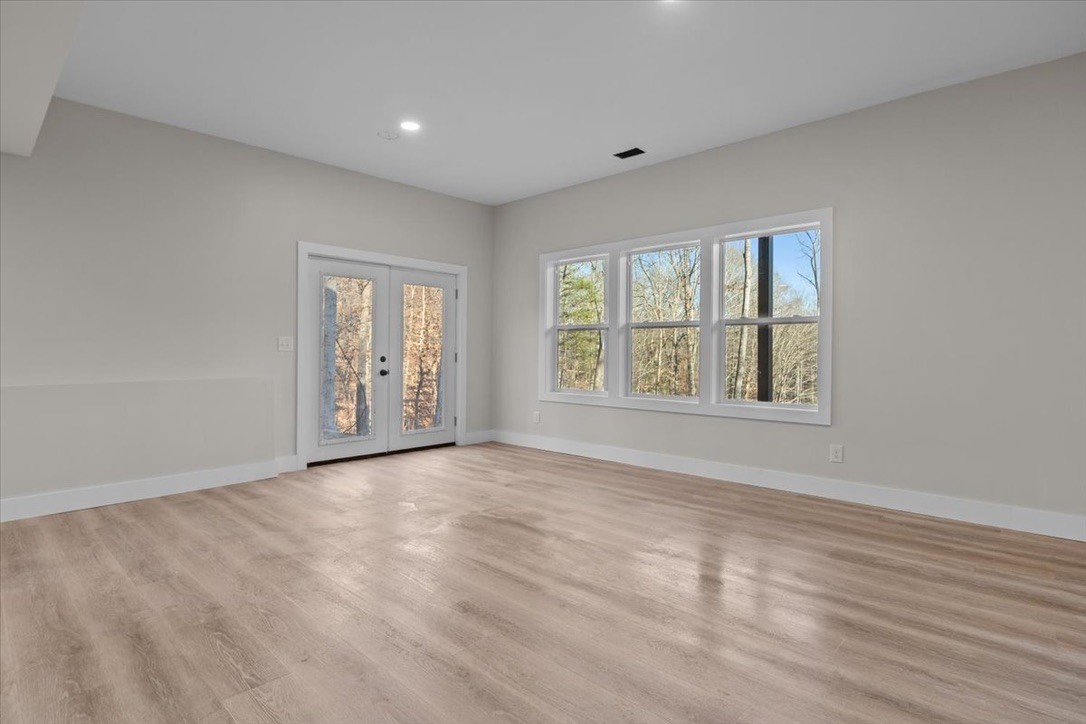 854 Little Leatherwood Road Vanleer, TN 37181 - Photo 30 of 36 wooden floor in an empty room with a window