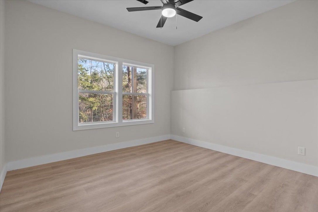 854 Little Leatherwood Road Vanleer, TN 37181 - Photo 31 of 36 wooden floor in an empty room with a window