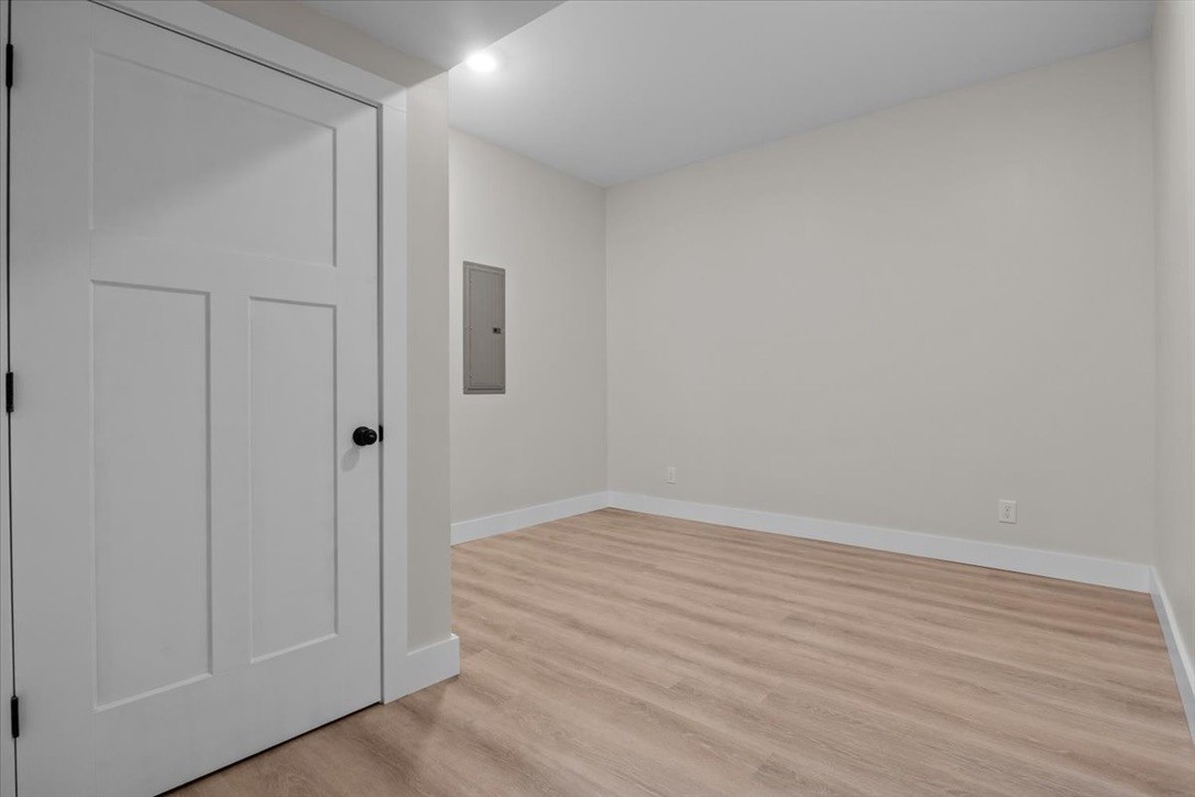 854 Little Leatherwood Road Vanleer, TN 37181 - Photo 32 of 36 a view of an empty room with wooden floor