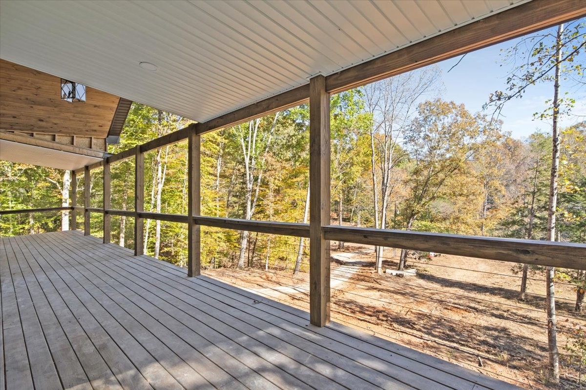 854 Little Leatherwood Road Vanleer, TN 37181 - Photo 5 of 36 a view of large windows with wooden floor