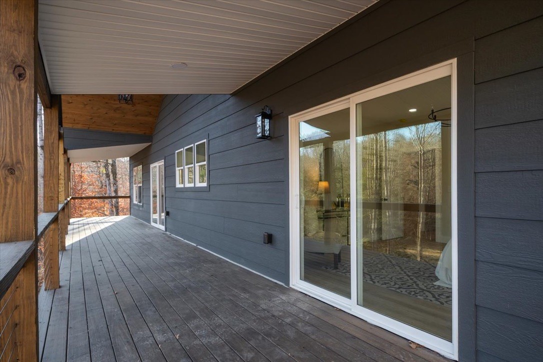 854 Little Leatherwood Road Vanleer, TN 37181 - Photo 6 of 36 a view of an empty room with wooden floor and a window
