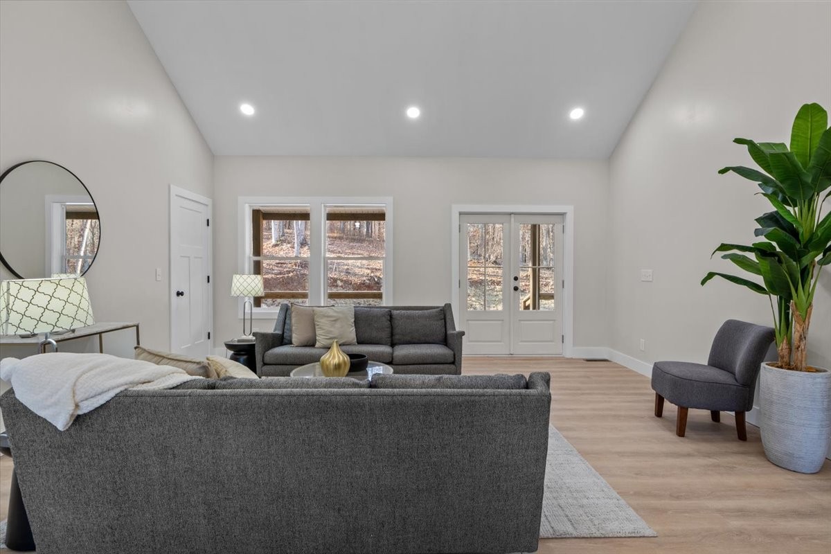 854 Little Leatherwood Road Vanleer, TN 37181 - Photo 10 of 36 a living room with furniture potted plant and a window