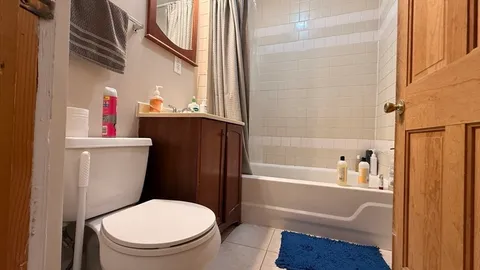 a bathroom with a sink a toilet and bathtub