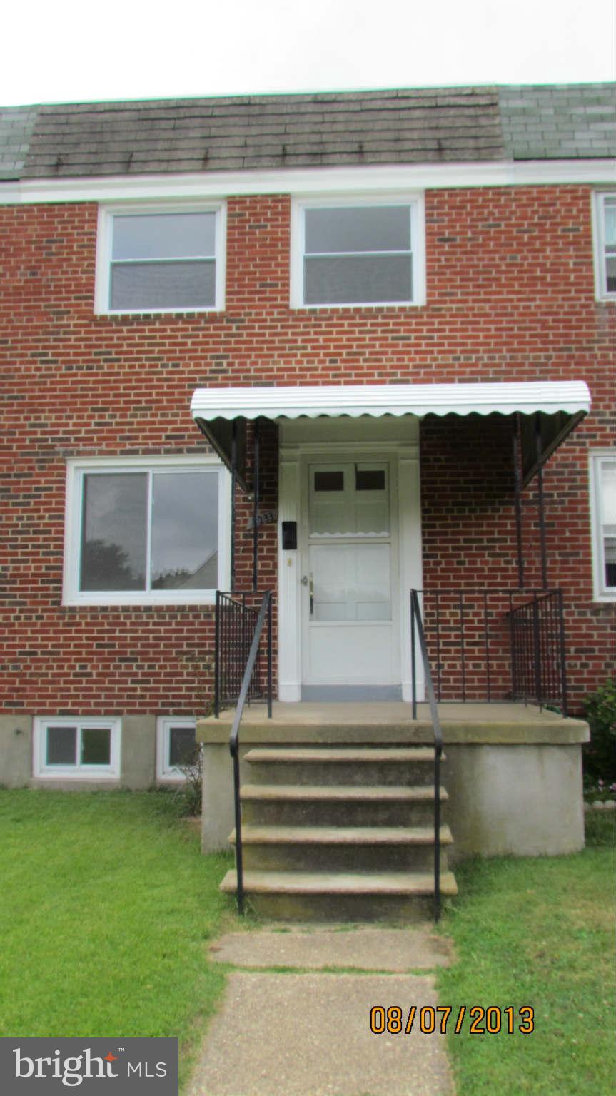 2233 Searles Road Baltimore, MD 21222 - Photo 1 of 15 a side view of a house with a garden