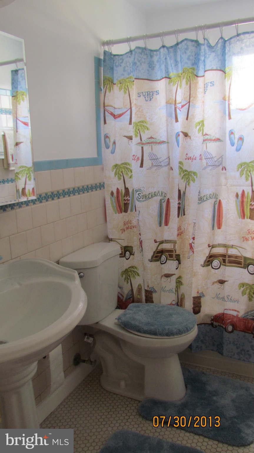 2233 Searles Road Baltimore, MD 21222 - Photo 11 of 15 a bathroom with a toilet and a sink
