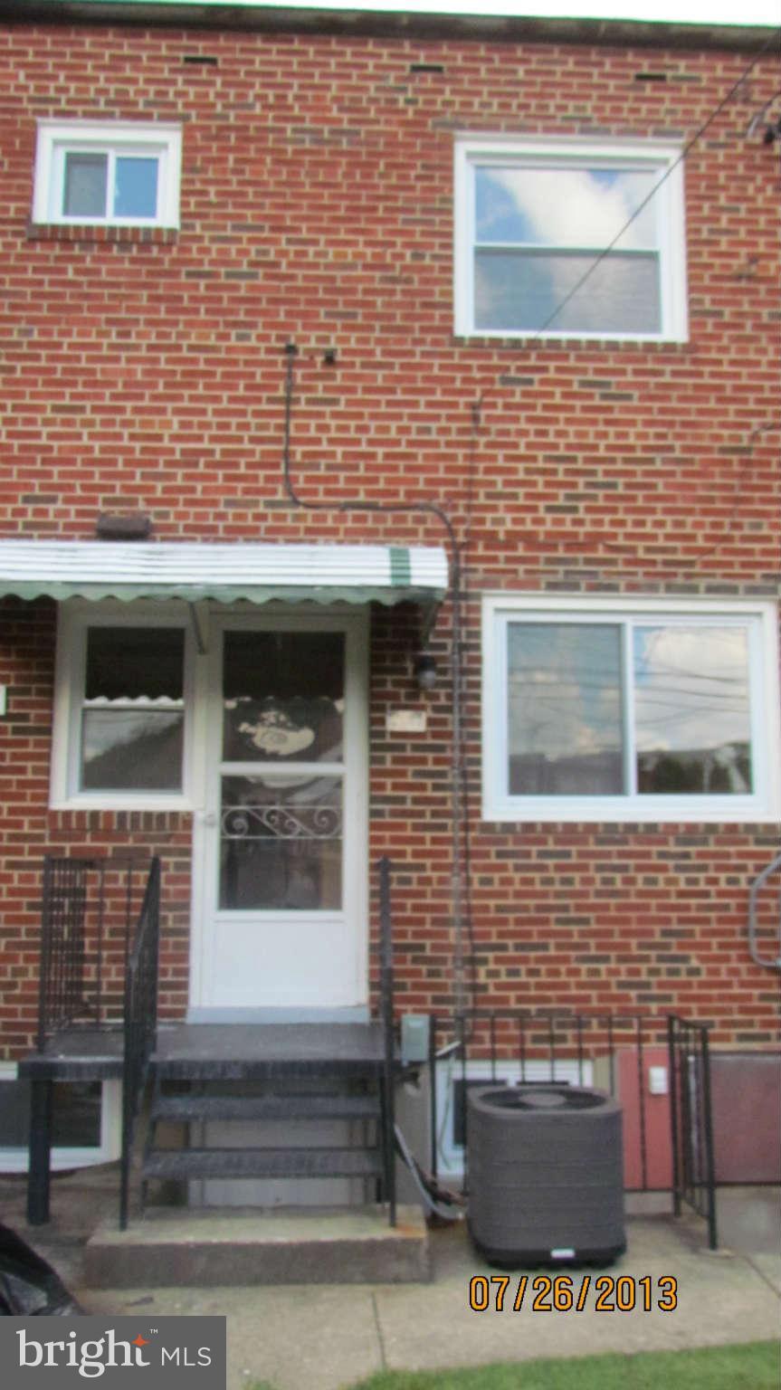 2233 Searles Road Baltimore, MD 21222 - Photo 15 of 15 a view of a brick house with windows